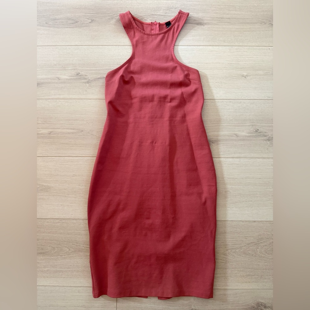 Coral body con dress with strappy details on the side and back